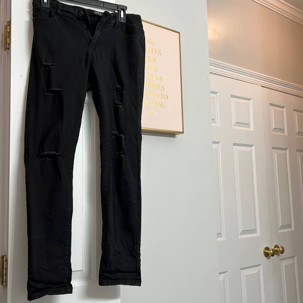 Black distressed jeans.